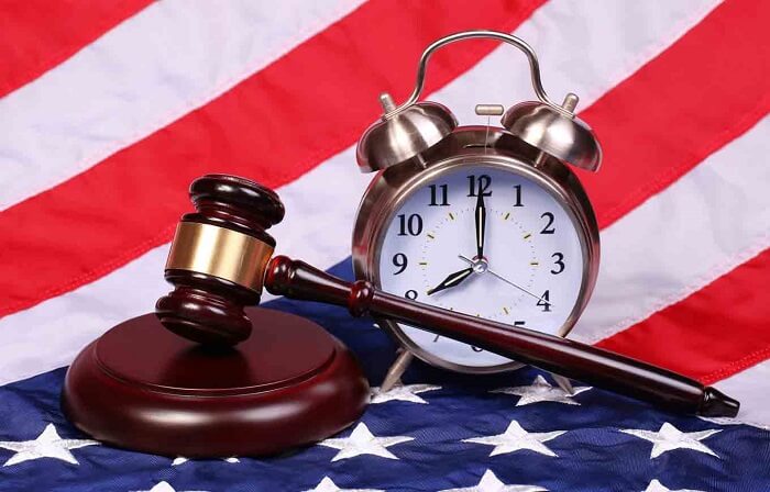 clock and gavel against the US flag